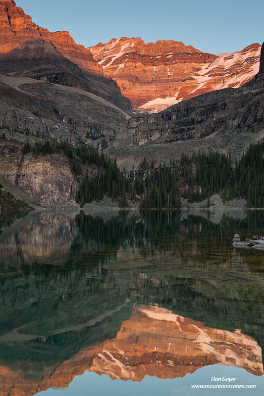 Image of Mount Lefroy reflected in Lake O'Hara, evening
