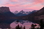 Image of pink cloud reflection in St. Mary's Lake in Glacier.