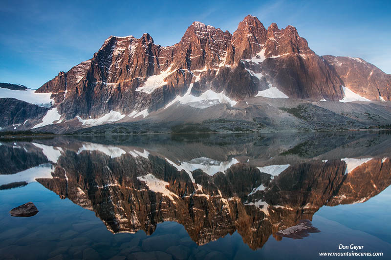 Image of The Ramparts reflected in Amethyst Lake, Tonquin Valley