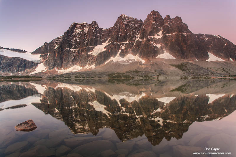 Image of The Ramparts reflected in Amethyst Lake, Tonquin Valley