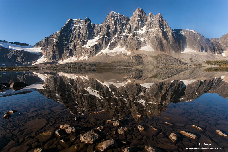 Image of The Ramparts reflected in Amethyst Lake, Tonquin Valley