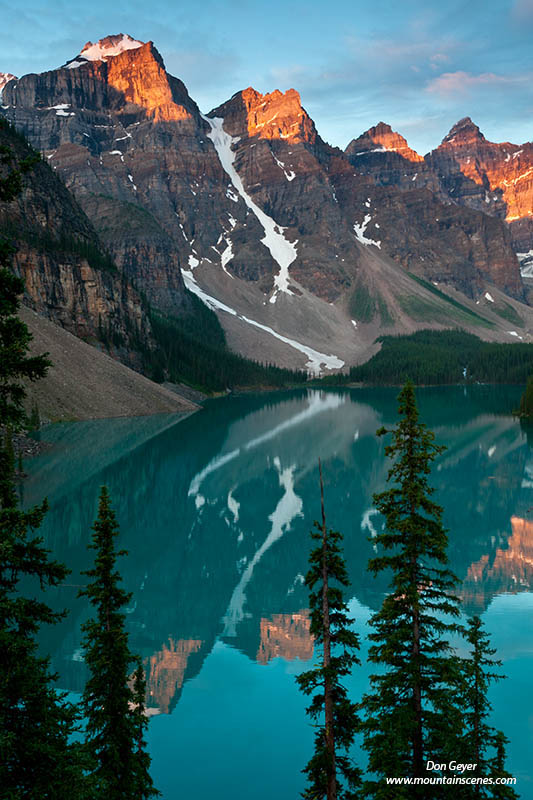 Image of Wenkchemna Peaks reflected in Moraine Lake, sunrise