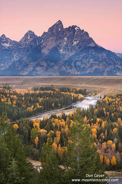 Image of Grand Teton above fall colors and Snake River, dawn, Grand Teton National Park