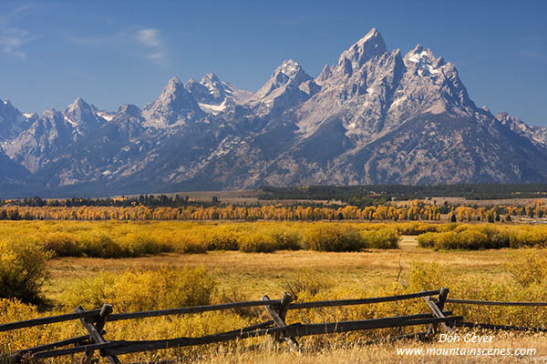 Image of Grand Teton above autumn colors, fence, Grand Teton National Park