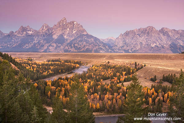 Image of Grand Teton above autumn colors and Snake River, dawn, Grand Teton National Park