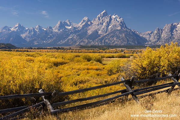 Image of Grand Teton above autumn colors, fence, Grand Teton National Park