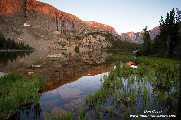 Picture of Alpenglow on Windy Mountain reflected in Cook Lake.