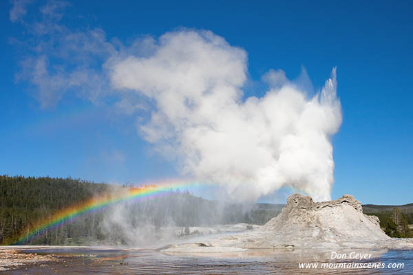 Image of Castle Geyser and rainbow, Yellowstone National Park.