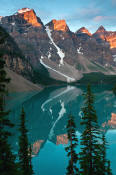 Image of Wenkchemna Peaks reflected in Moraine Lake, sunrise