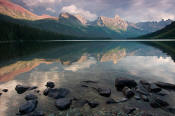 Image of Storm clouds reflected in Lake Elizabeth in Glacier.