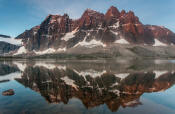 Image of The Ramparts reflected in Amethyst Lake, Tonquin Valley