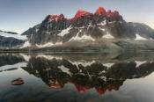 Image of The Ramparts reflected in Amethyst Lake, Tonquin Valley