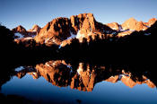 Palisades reflected in Sixth Lake at sunrise.