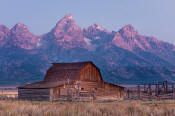 Image of Grand Teton above barn along Mormon Row at dawn, Grand Teton National Park