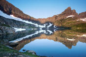 Image of Cathedral Peak reflected in Sue Lake in Glacier.